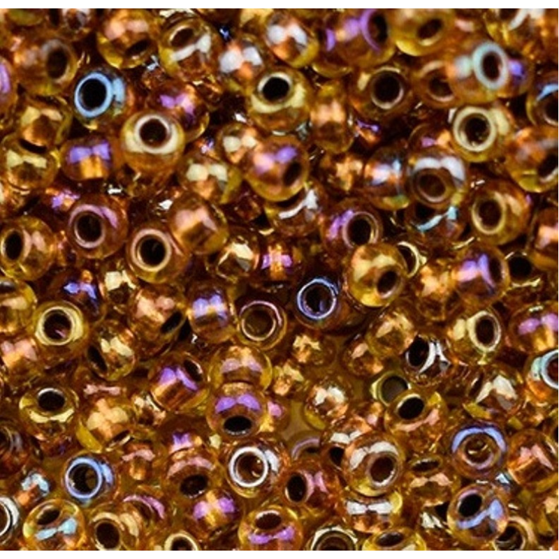19029 бісер №10 Preciosa (Чехія) 5 грамів. Прозорий райдужний із мідною серединкою