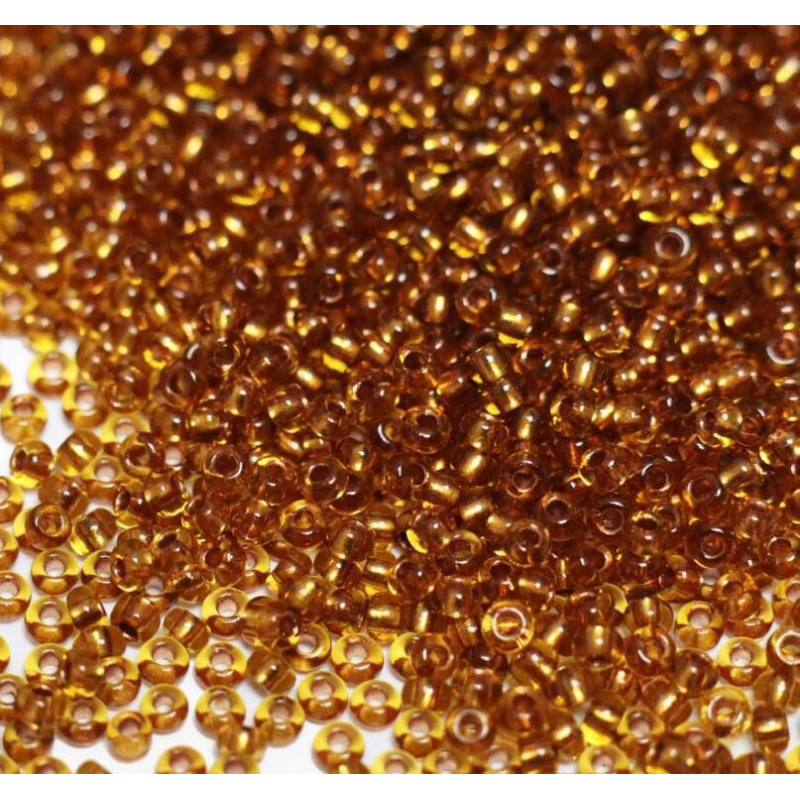 19050 бісер №10 Preciosa (Чехія) 5 грамів. Прозорий із мідною серединкою