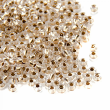 68106 бісер №10 Preciosa (Чехія) 5 грамів. Прозорий з бронзовой серединкою