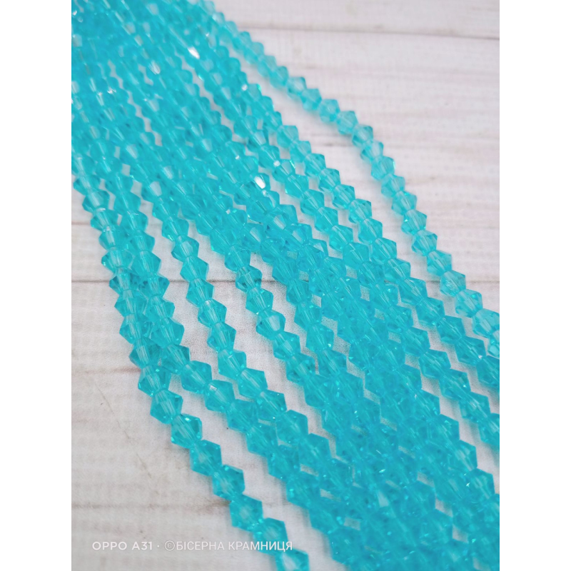 Біконус, розмір 4*4 мм. Аквамариновий прозорий