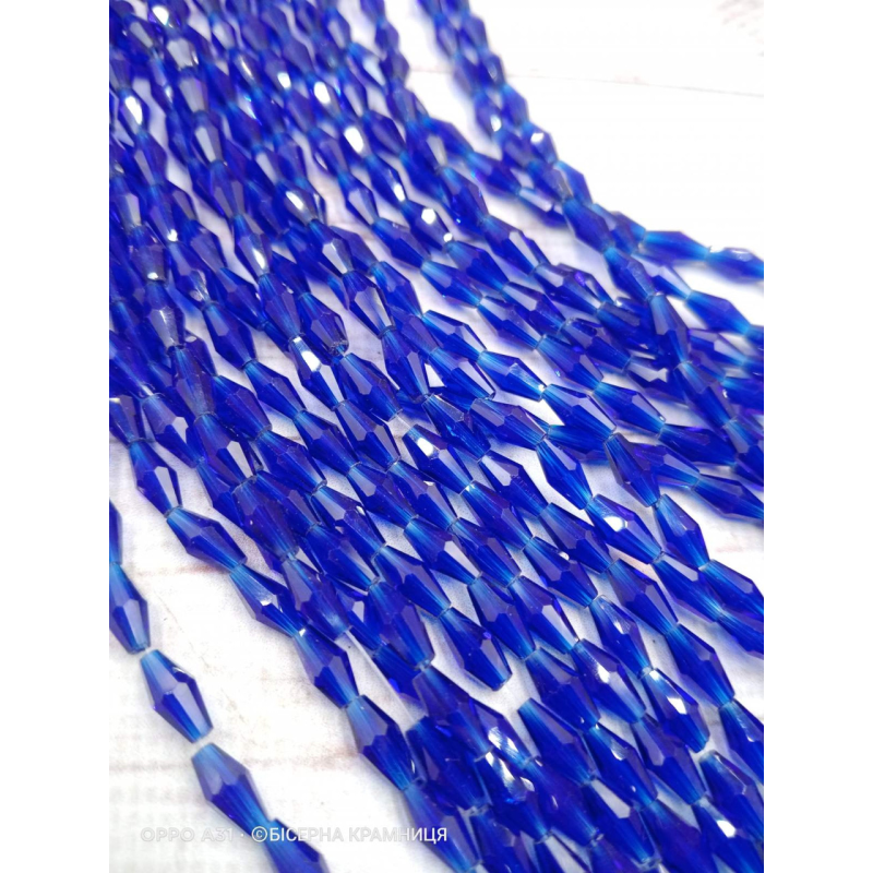 Біконус, розмір 4*8 мм. Сині прозорі