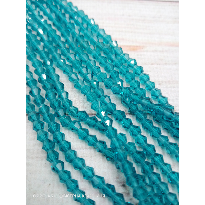 Біконус, розмір 4*4 мм. Бірюзовий синій прозорий